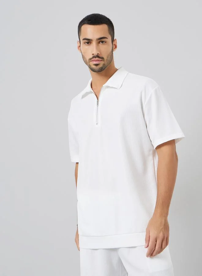 ستايلي طقم منسق من بولو سادة بقصة واسعة وشورت