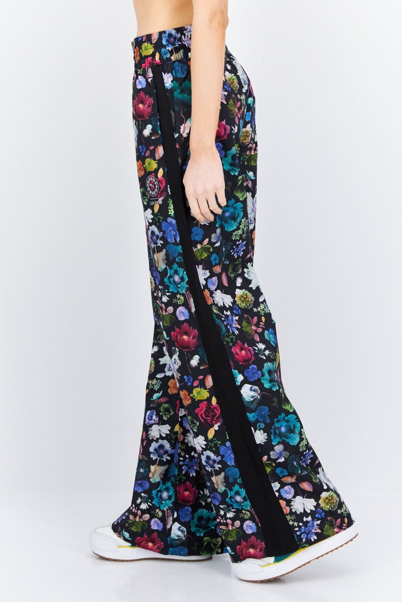 PUMA Women Sportswear Fit Floral Print Outdoor Track Pant, Black Combo - Image 4