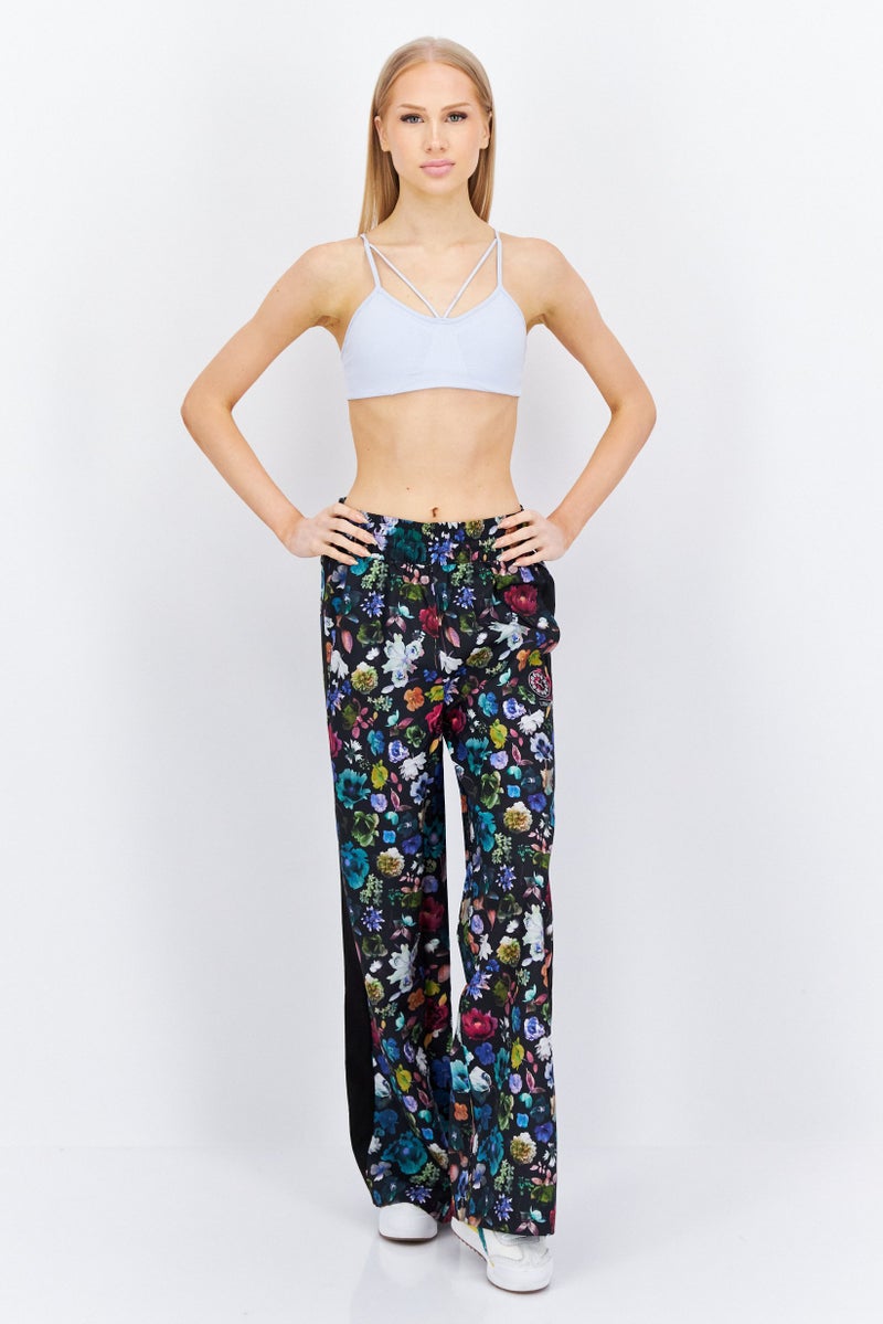 PUMA Women Sportswear Fit Floral Print Outdoor Track Pant, Black Combo - Image 2