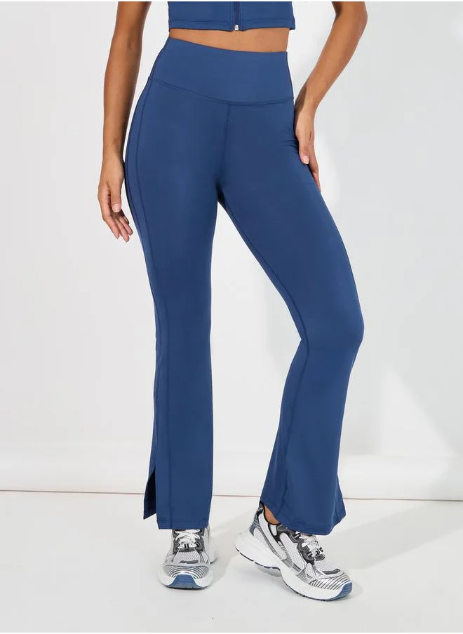 Styli Overall Tonal Stitch Detail Zip Up Longline Sport Bra & Flared Leggings Set