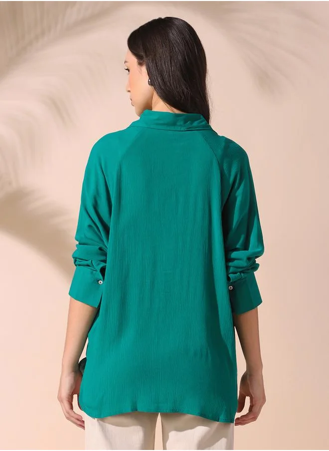 Dennis Lingo Women green oversized solid full sleeves button down rayon shirts with button closure featuring a spread collar- your next go-to for effortless flair.