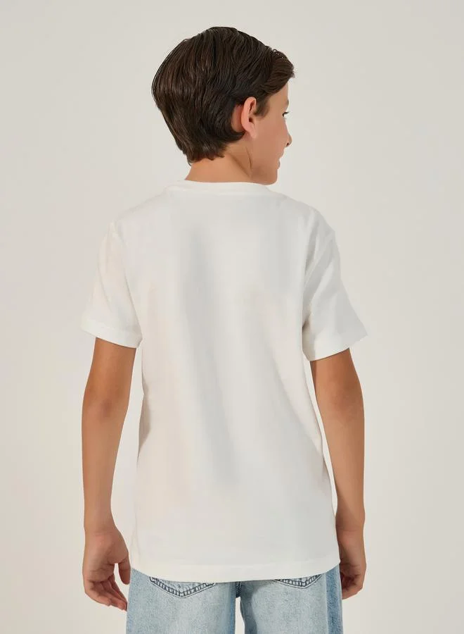 Styli Graphic Print Round Neck T-Shirt with Badge Detail
