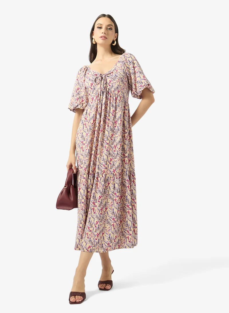FYOR  Printed Tie-Up Neck Flowy Midi Dress for Women | Best Price UAE