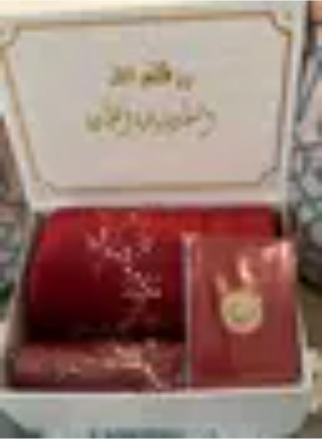 Prayer set featuring a prayer gown and mat, along with a Quran and prayer beads. An elegant gift box for women.