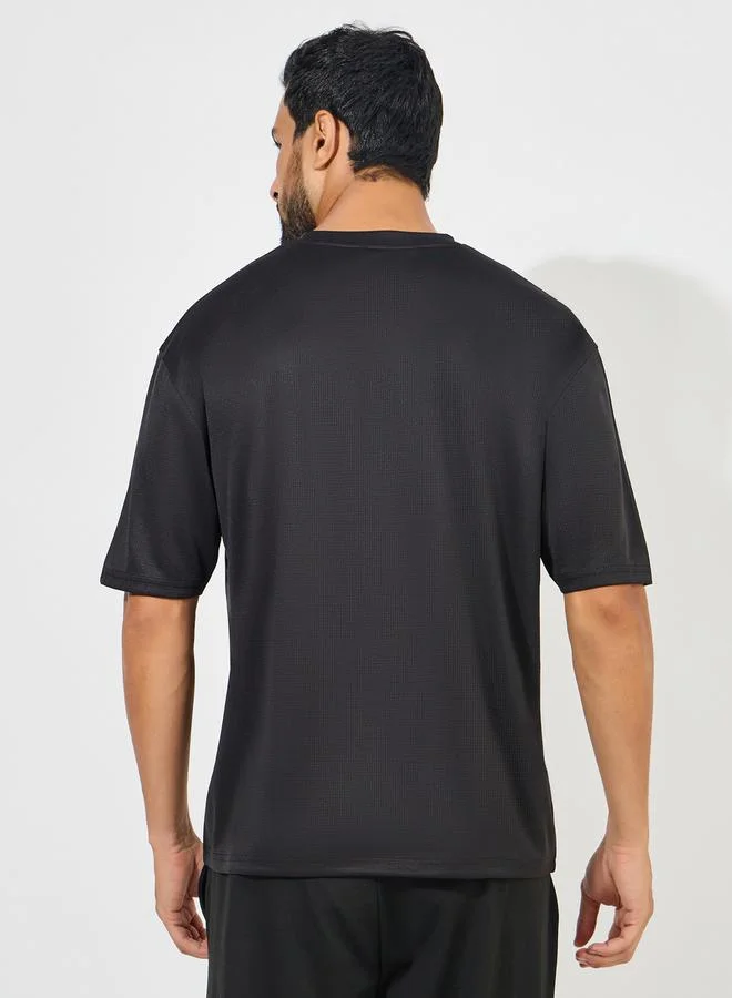 Styli Soft Texture Badge Detail Oversized Athleisure T-Shirt