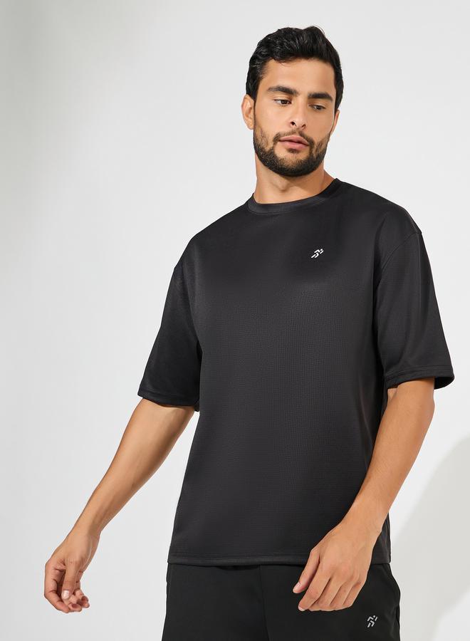 ستايلي اكتيف تيشيرت رياضي واسع بتفاصيل شعار ملمس ناعم - Image 1
