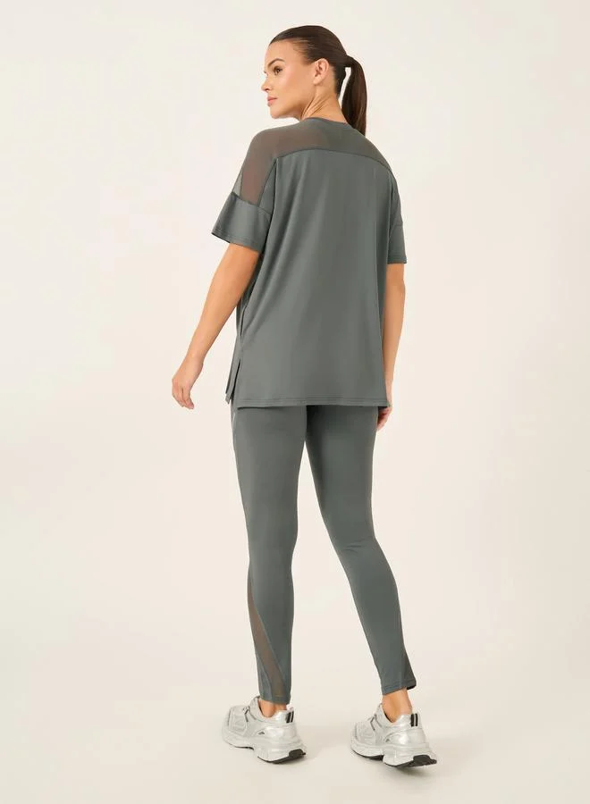 Styli Active  Pack of 3 - Shoulder Mesh Detail Top, Back Dual Tear Drop Sports Bra and Leggings for Women | Best Price UAE