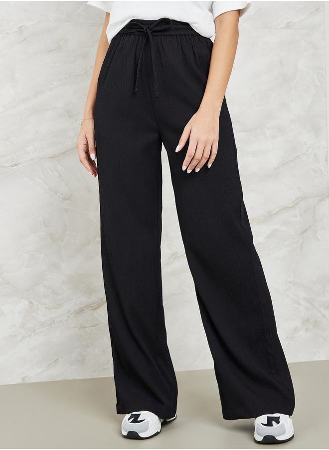 Styli - Textured Wide Leg Pants with Side Pocket - Image 1
