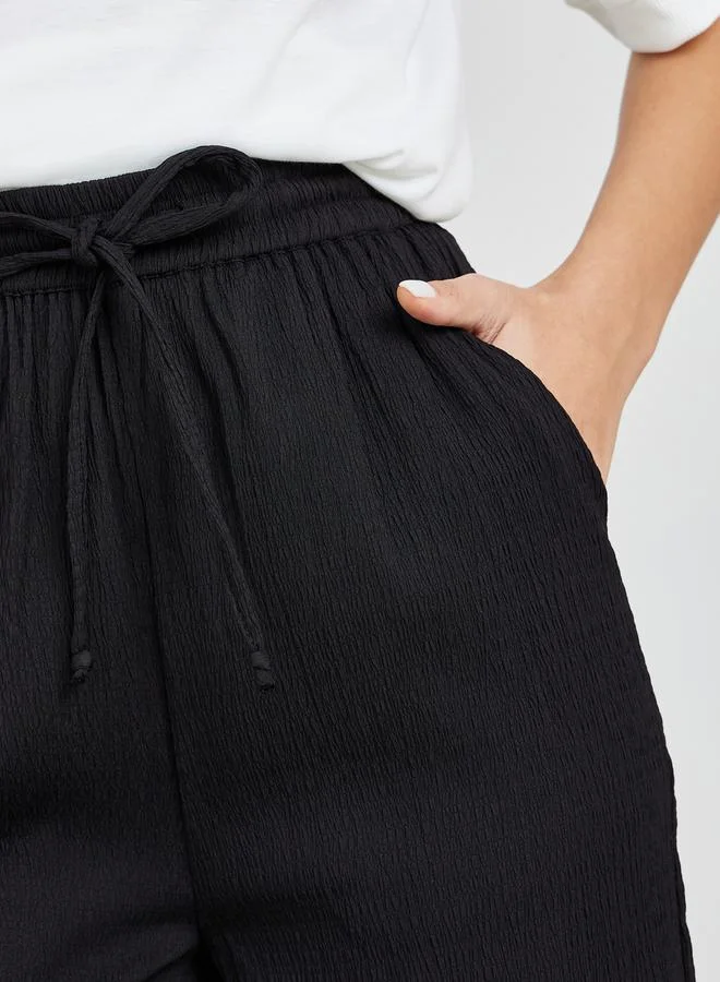 ستايلي Textured Wide Leg Pants with Side Pocket