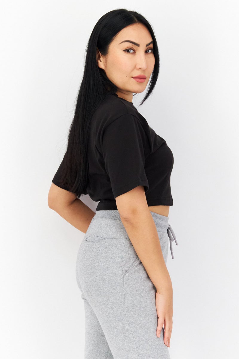 PUMA Women Relaxed Fit Short Sleeve Brand Logo Training Crop Top, Black  - Image 2