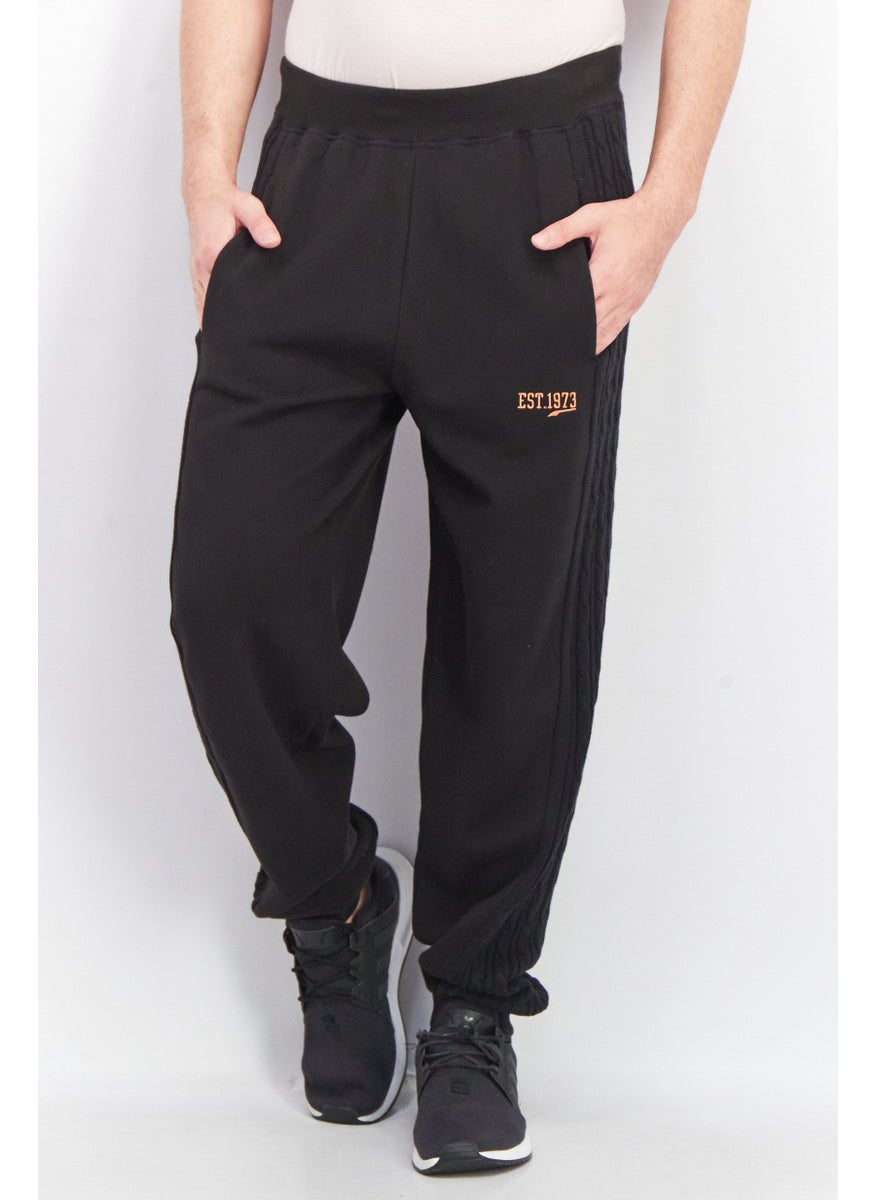 PUMA Men Sportswear Fit Textured Jogger Pants, Black  - Image 1