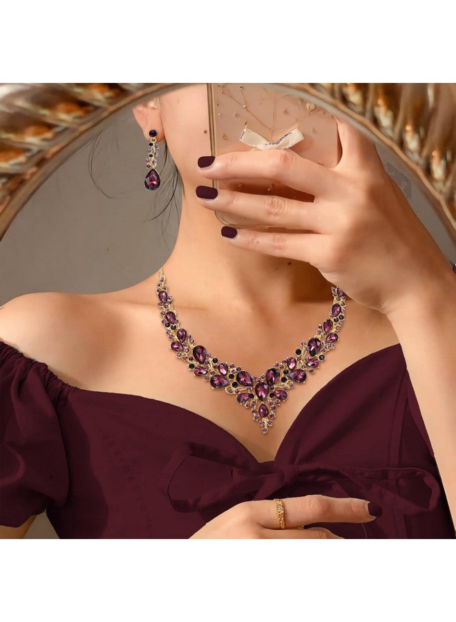 بريلوف طقم مجوهرات للنساء من عقد وأقراط على شكل دمعة من الكريستال النمساوي، طقم أقراط متدلية على شكل دمعة من اللون الجمشتي الداكن مع لمسة ذهبية - Image 2