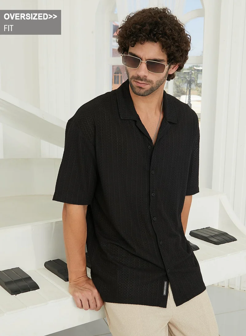 Campus Sutra Campus Sutra Men's Midnight Black Zigzag-Helix Resort Oversized Shirt For Casual Wear | Cuban Collar | Short Sleeves | Button Closure | Oversize Shirt Crafted With Comfort Fit For Everyday Wear