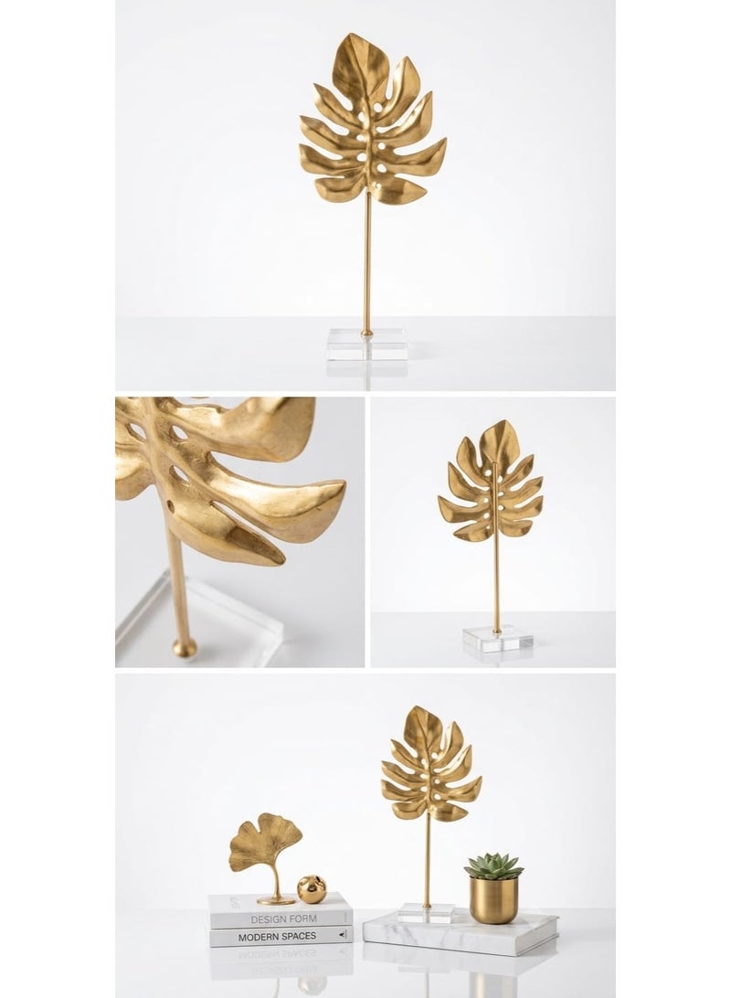 A stunning gold metal decorative piece in the shape of a tropical monstera leaf with a transparent acrylic base - a modern and elegant decoration for tables and bookshelves - Image 2