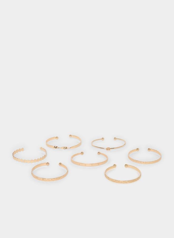 ستايلي طقم مكون من 7 أساور بانغل ذهبية - Image 1