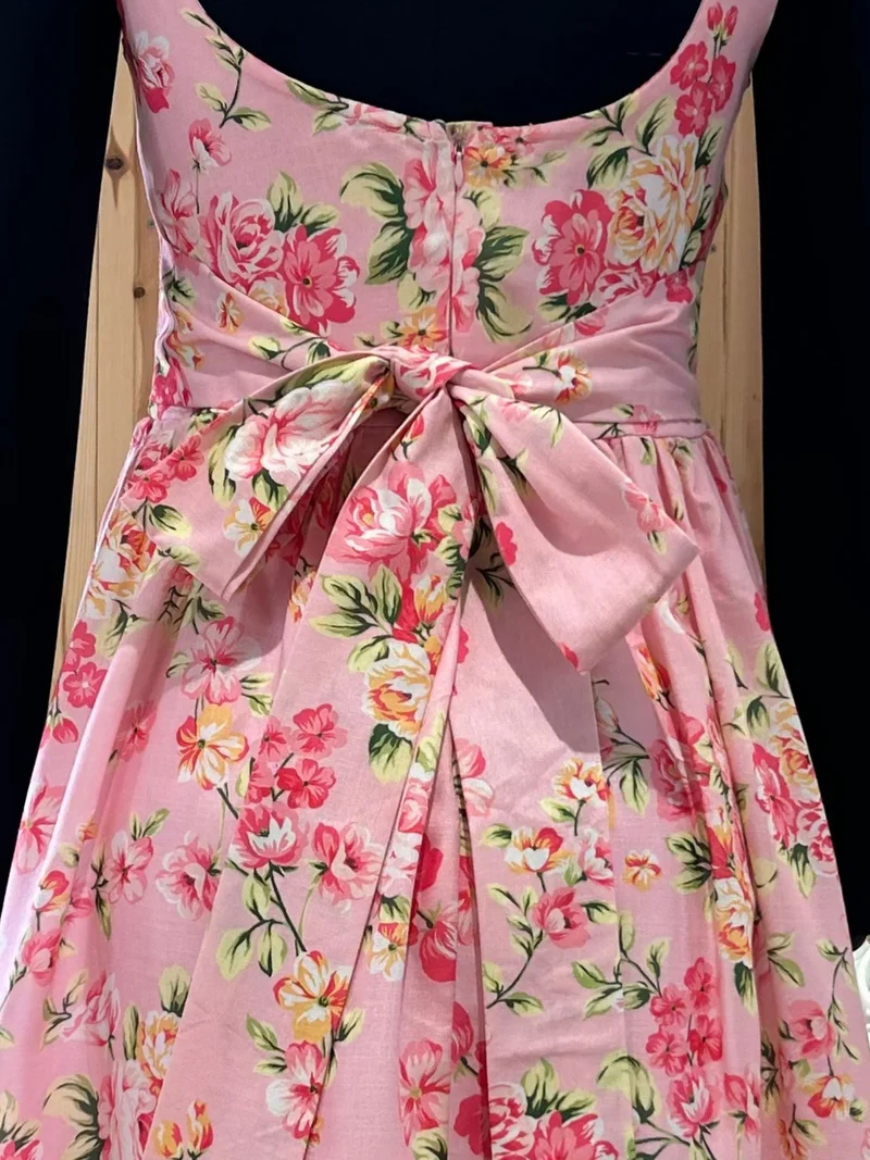 Outzidr  Pink Elegant Printed Midi Dress With Flowy Skirt And Back Bow Detail for Women | Best Price UAE