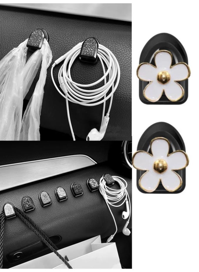 Self-adhesive car hook and organizer in the shape of  white rose, adding a touch of elegance to your car's decor. It can be used for organizing and hanging wires, headphones, sleeves, and bags.