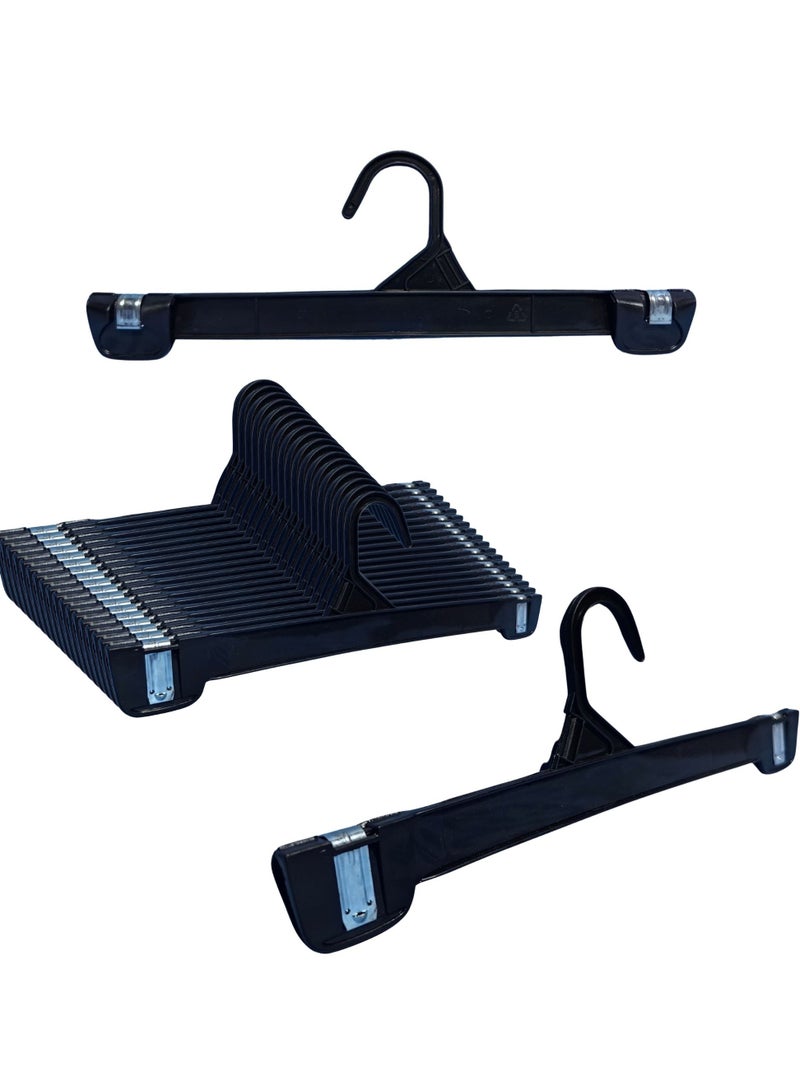 أورتوك 12 قطعة من الشماعات السفلية مع مشابك معدنية قوية، شماعات بلاستيكية موفرة للمساحة، شماعات ملابس بمشابك مانعة للانزلاق، شماعات بنطلون سوداء بمشبك دفع لأعلى للبنطلون والجينز والفستان والقميص - 31 × 10 سم - Image 1