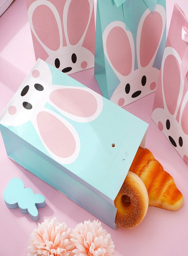 JarThenaAMCS أكياس هدايا حفلات عيد الفصح من JarThenaAMCS، 24 قطعة، بتصميم أرنب وردي وأزرق، مصنوعة من الورق المقوى ومزينة بشرائط. مثالية لتوزيع الحلوى والهدايا في حفلات الربيع، وحفلات استقبال المولود، وأعياد الميلاد. - Image 4