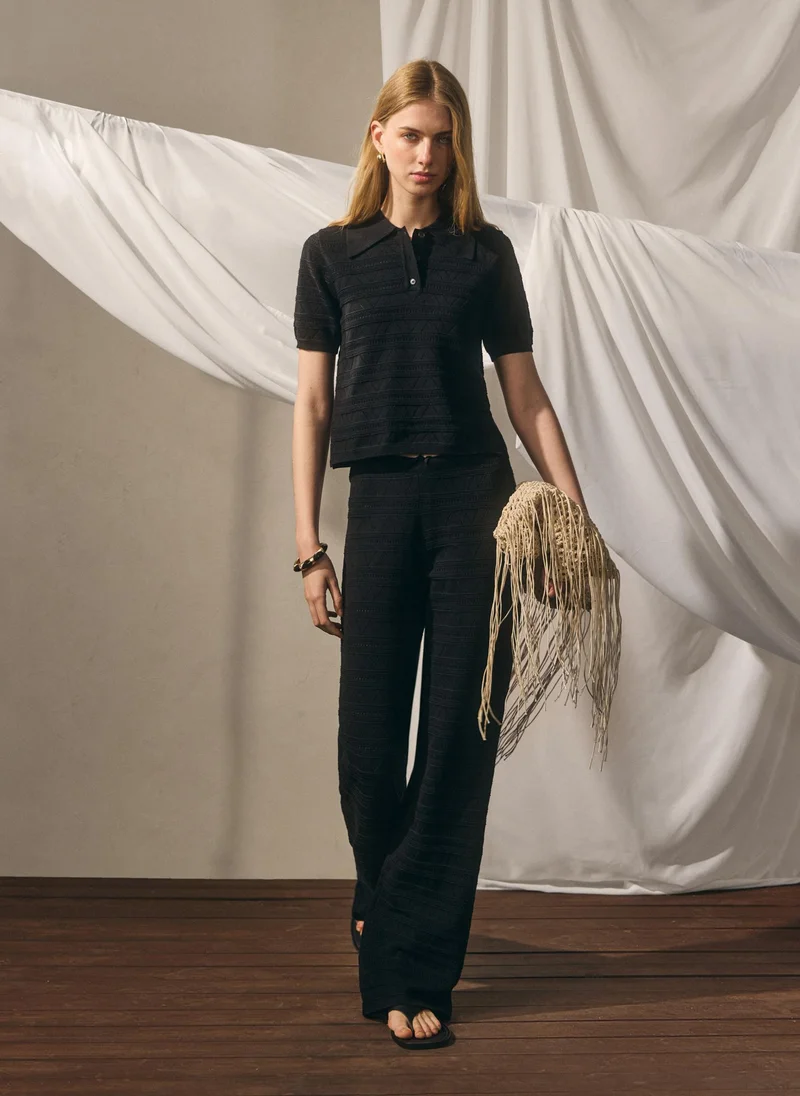 Knitted polo shirt with geometric pattern
