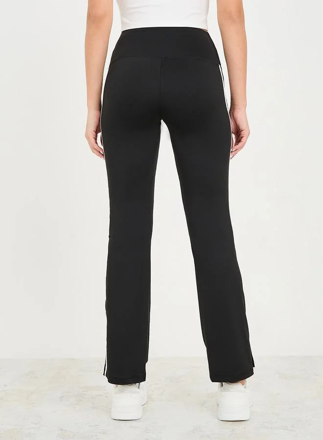 Styli Active Side Stripe Detail Slit Hem Flared Leggings