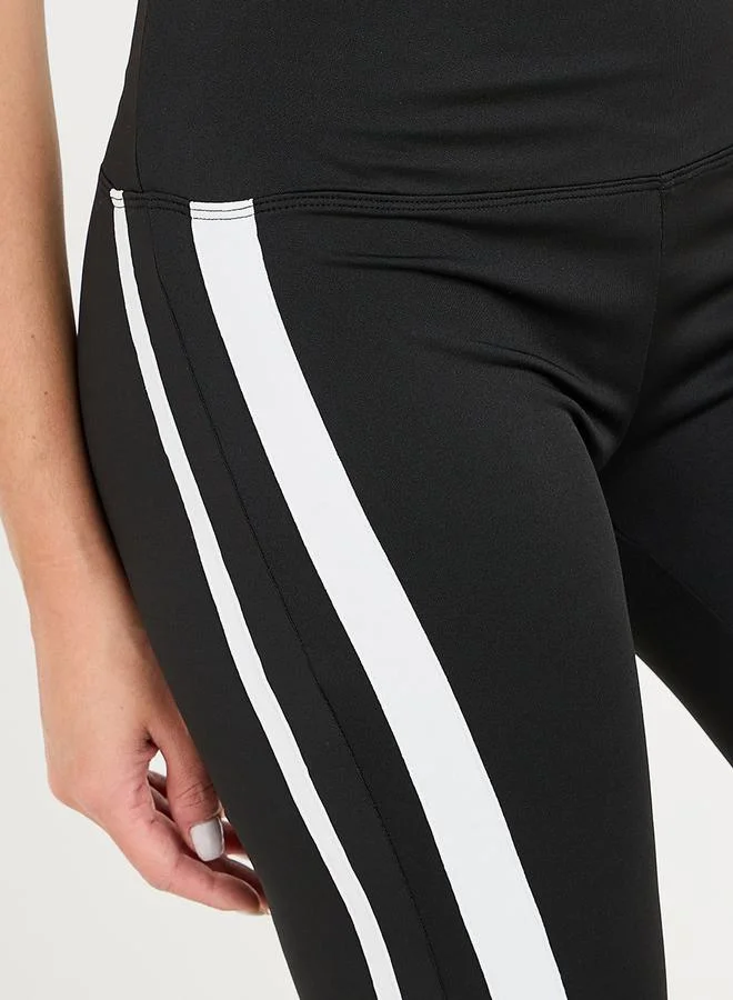 Styli Active Side Stripe Detail Slit Hem Flared Leggings