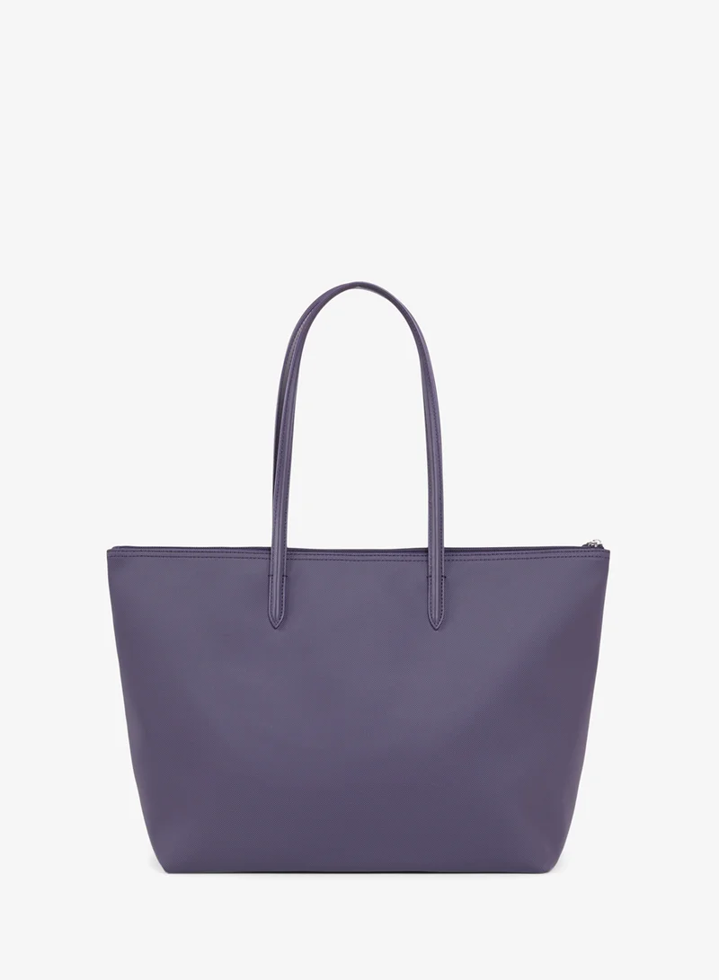 Lacoste  The iconic L1212 style in a large shopping bag for Women | Best Price UAE