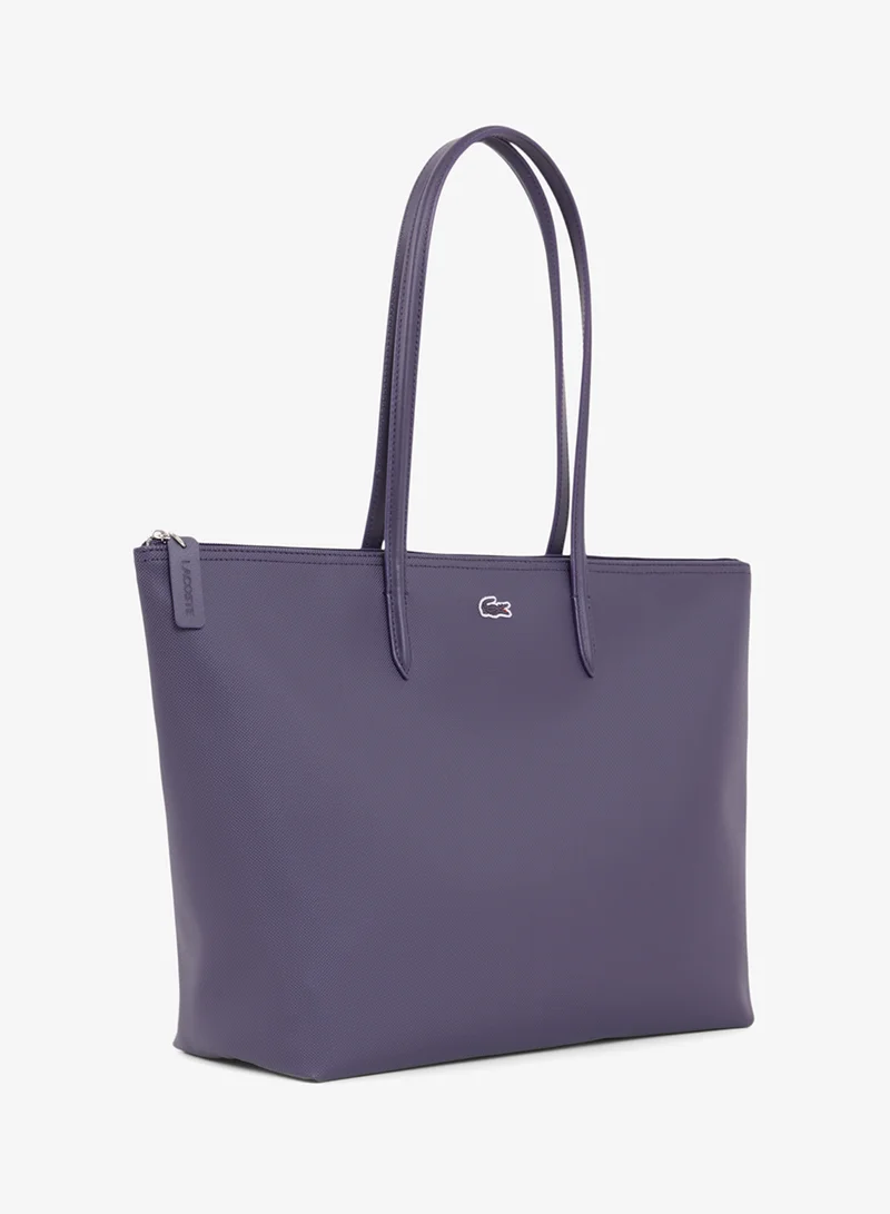 Lacoste  The iconic L1212 style in a large shopping bag for Women | Best Price UAE