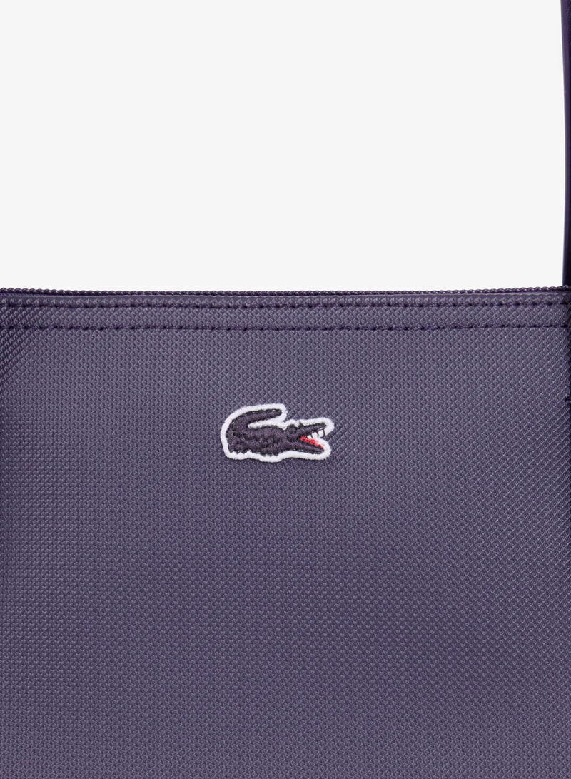Lacoste  The iconic L1212 style in a large shopping bag for Women | Best Price UAE