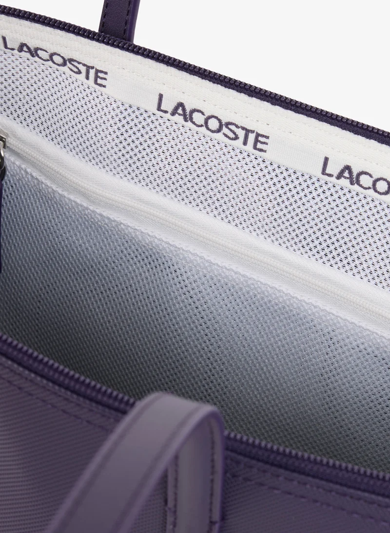 Lacoste  The iconic L1212 style in a large shopping bag for Women | Best Price UAE