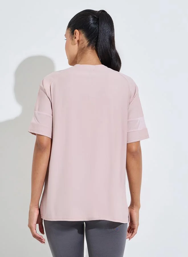 Styli Active  Pink Solid Mesh Insert Sleeves Side Slit Active T-Shirt for Women | Best Price UAE