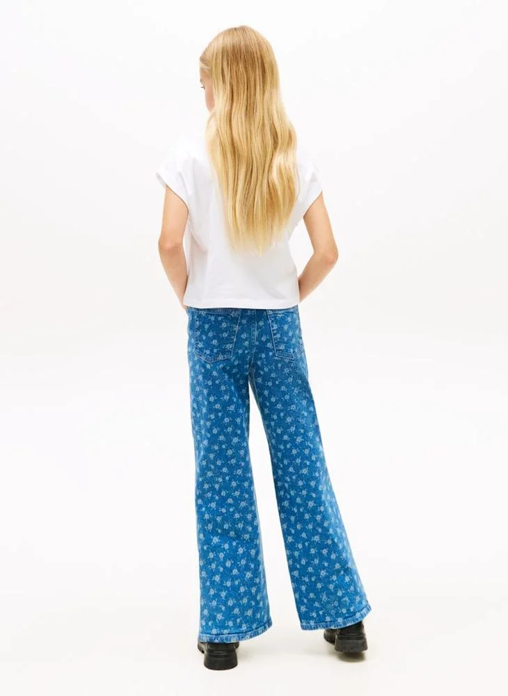 تومي هيلفيغر تيشيرت للأطفال بياقة مستديرة مزين بزهرة منفوشة