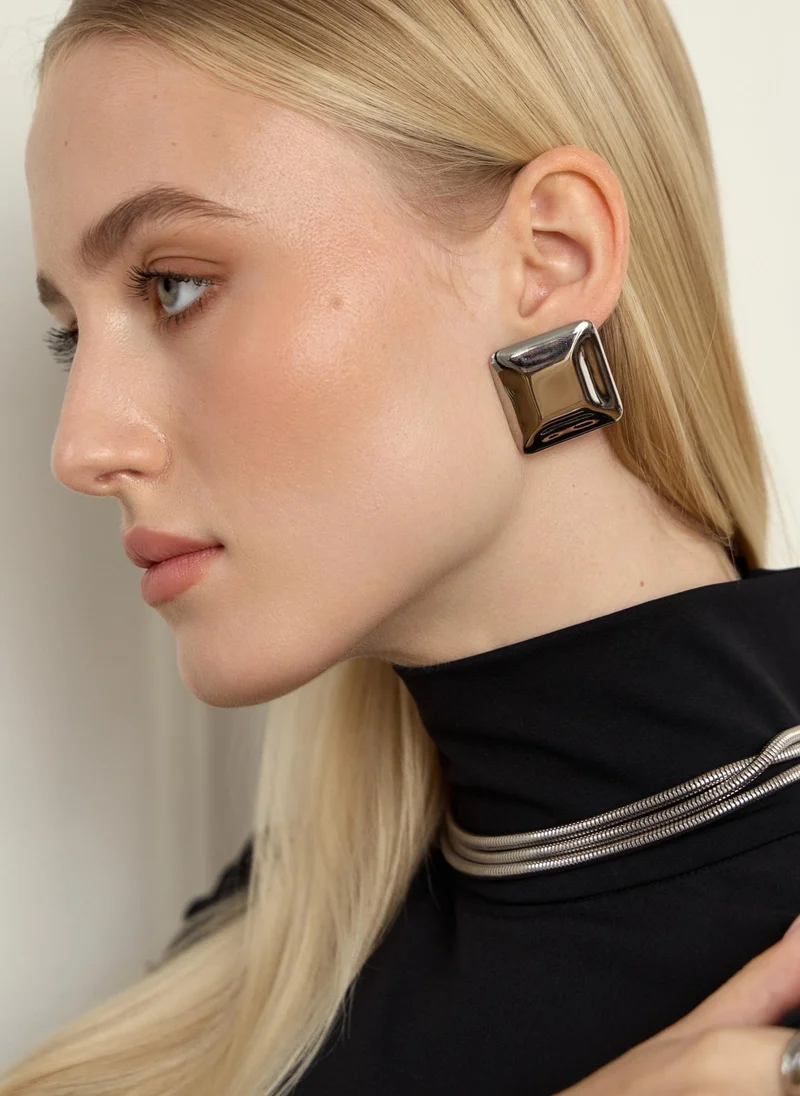 Square stud earrings in glossy metal