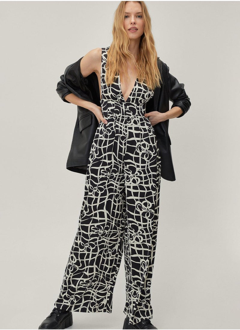 Plunge Neck Printed Jumpsuit - pzsku/Z3BC1B9BEB51255E1179AZ/45/_/1698933863/3a452017-6338-41ae-b36d-e5f297388e91