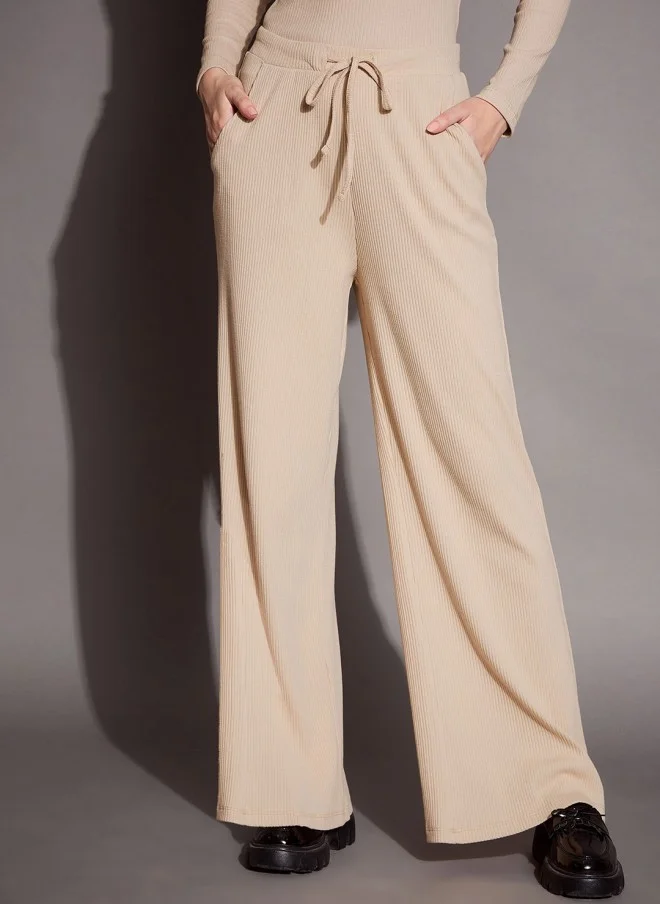 Beige Ribbed Relaxed Fit Track Pants for Women