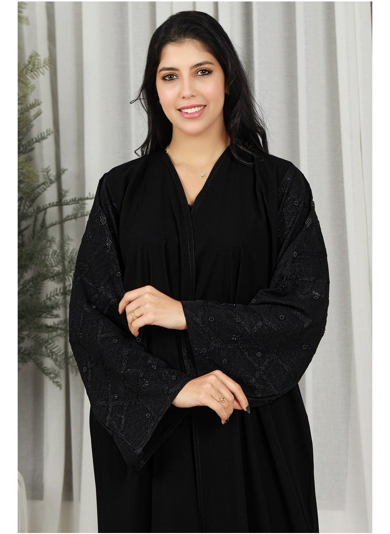 Gaiyda - Black abaya with floral fabric on the sleeves - Image 1
