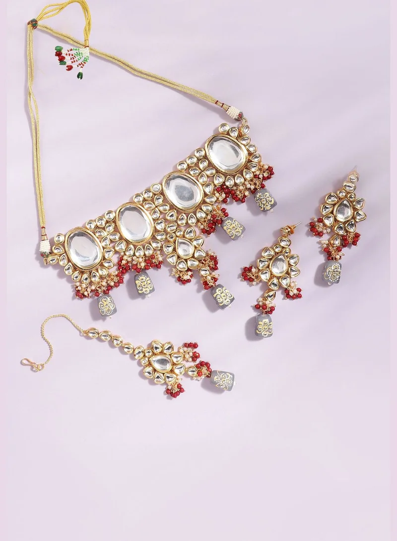 SOHI Gold Plated Designer Stone Party Necklace, Earrings and Maang Tikka Set For Women