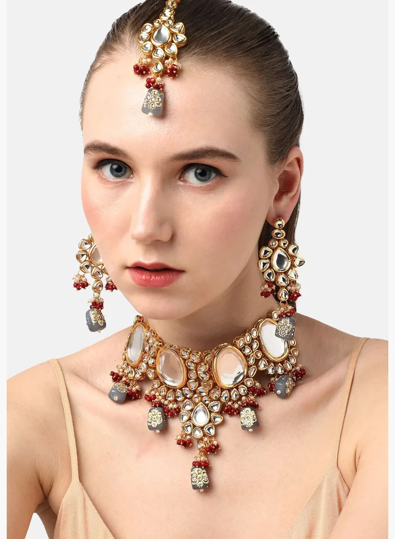 SOHI Gold Plated Designer Stone Party Necklace, Earrings and Maang Tikka Set For Women