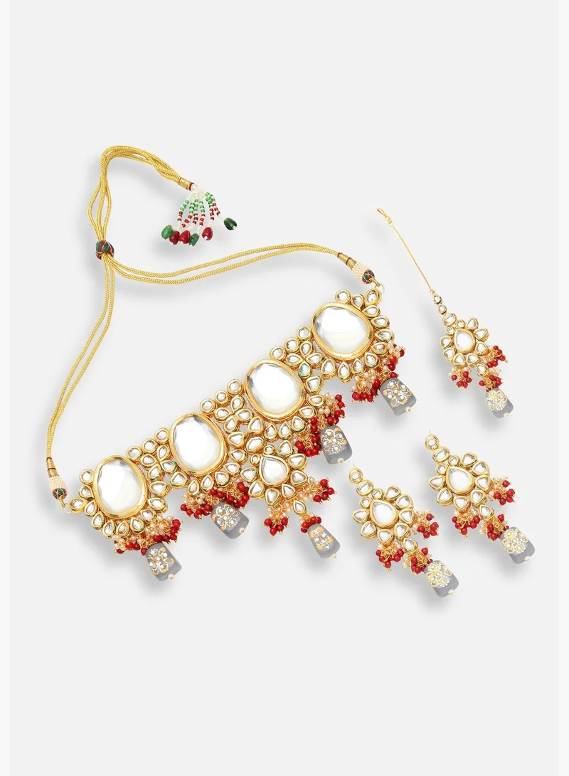 SOHI Gold Plated Designer Stone Party Necklace, Earrings and Maang Tikka Set For Women