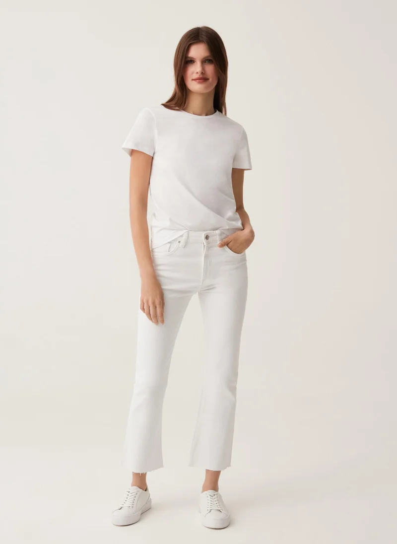 او في اس OVS Flare-Fit Jeans With Raw Edging