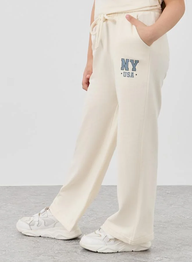 Styli Styli Slogan Print T-Shirt and Wide Leg Joggers Set