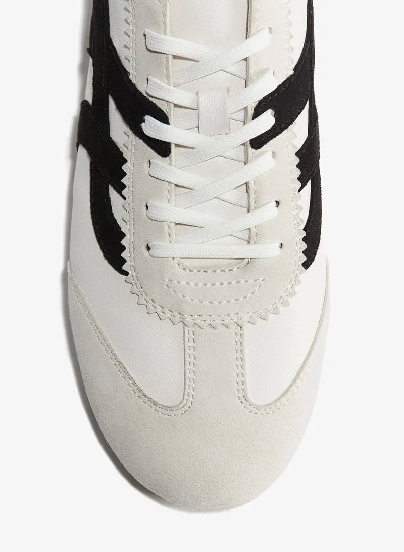 اتش اند ام تنورة محبوكة من نسيج مرن