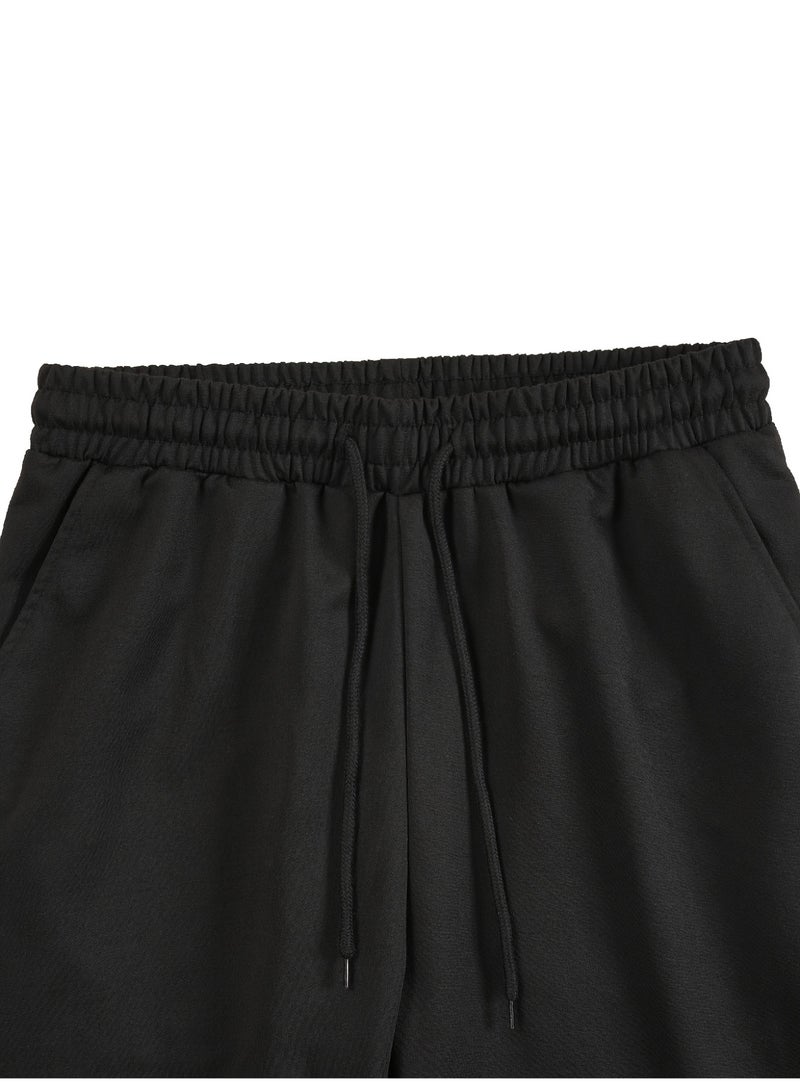 بنطال رياضي رجالي أسود اللون بأجزاء مضلعة ورباط على الخصر وبنطال رياضي غير رسمي ضيق - Image 4