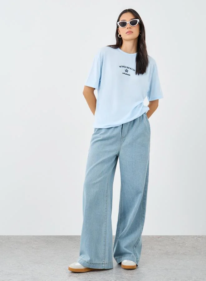 Styli Women Light Blue Bondi Beach Embroidered Oversized T-Shirt