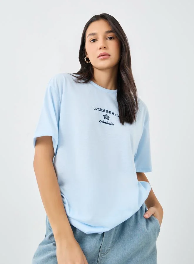 Styli Women Light Blue Bondi Beach Embroidered Oversized T-Shirt