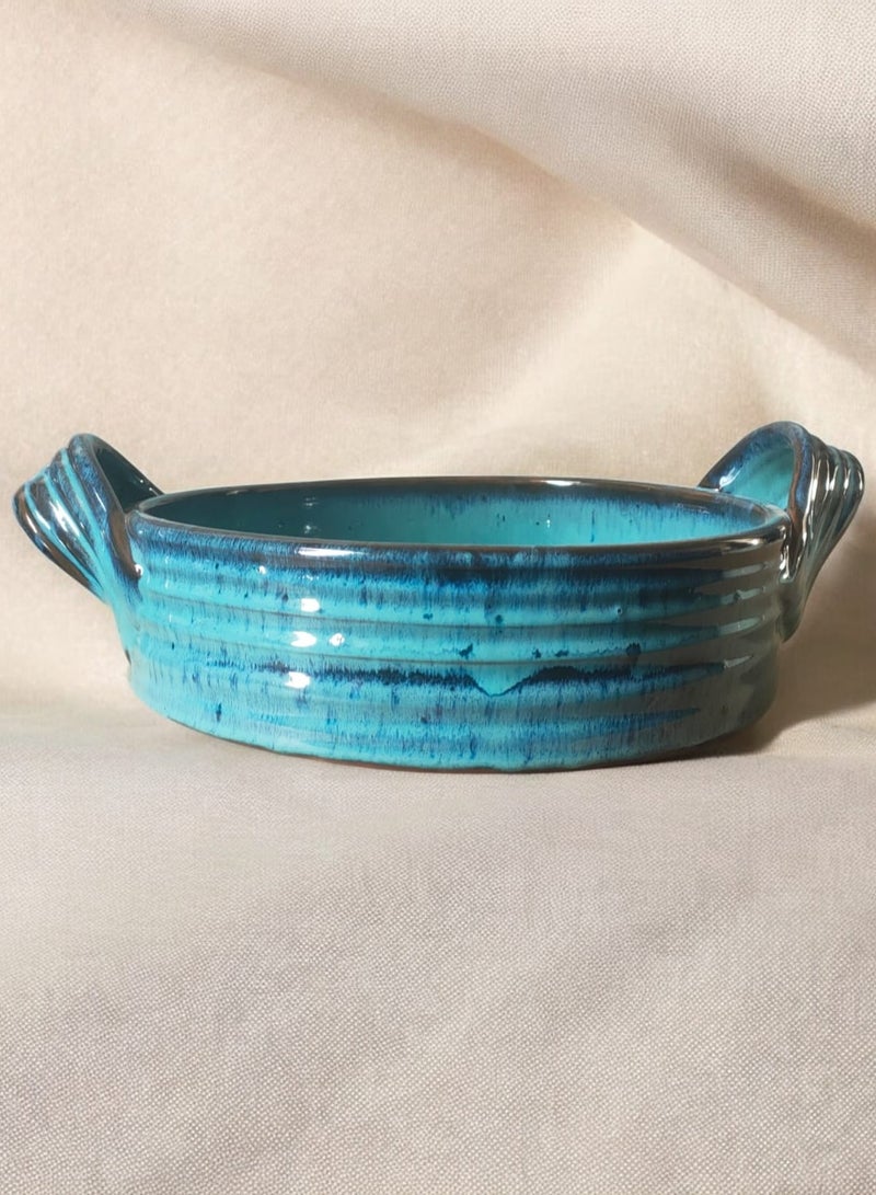 A casserole with a handle made of pottery and porcelain that can withstand direct and indirect heat, flame or in the oven. - Image 1