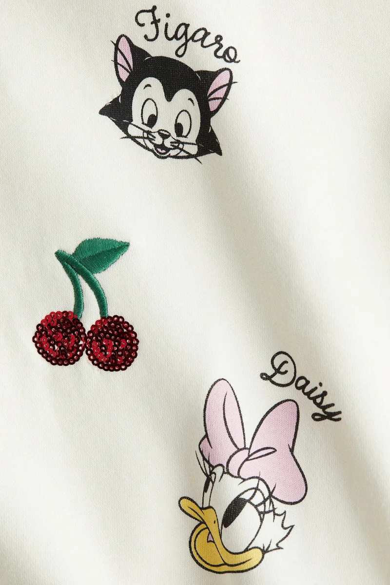 اتش اند ام بلوزة من نسيج سويت شيرت مزينة بطبعة