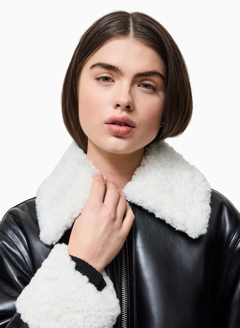 French Connection Black Cream Ajani Faux Fur Coat for Women | Best Price UAE