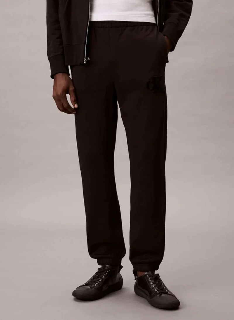 Calvin Klein Jeans  Fleece Monogram Logo Patch Joggers  | Best Price UAE