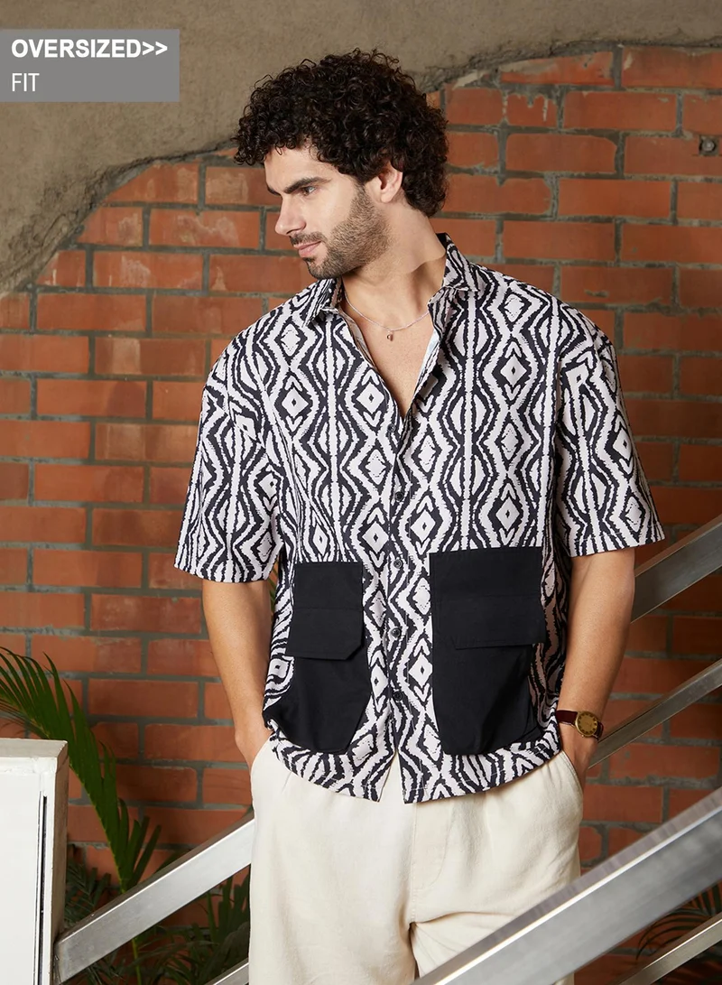 Campus Sutra Campus Sutra Men's Black & White Indie-Utility Oversized Shirt For Casual Wear | Spread Collar | Short Regular Sleeves | Button Closure | Oversized Shirt Crafted With Comfort Fit For Everyday Wear
